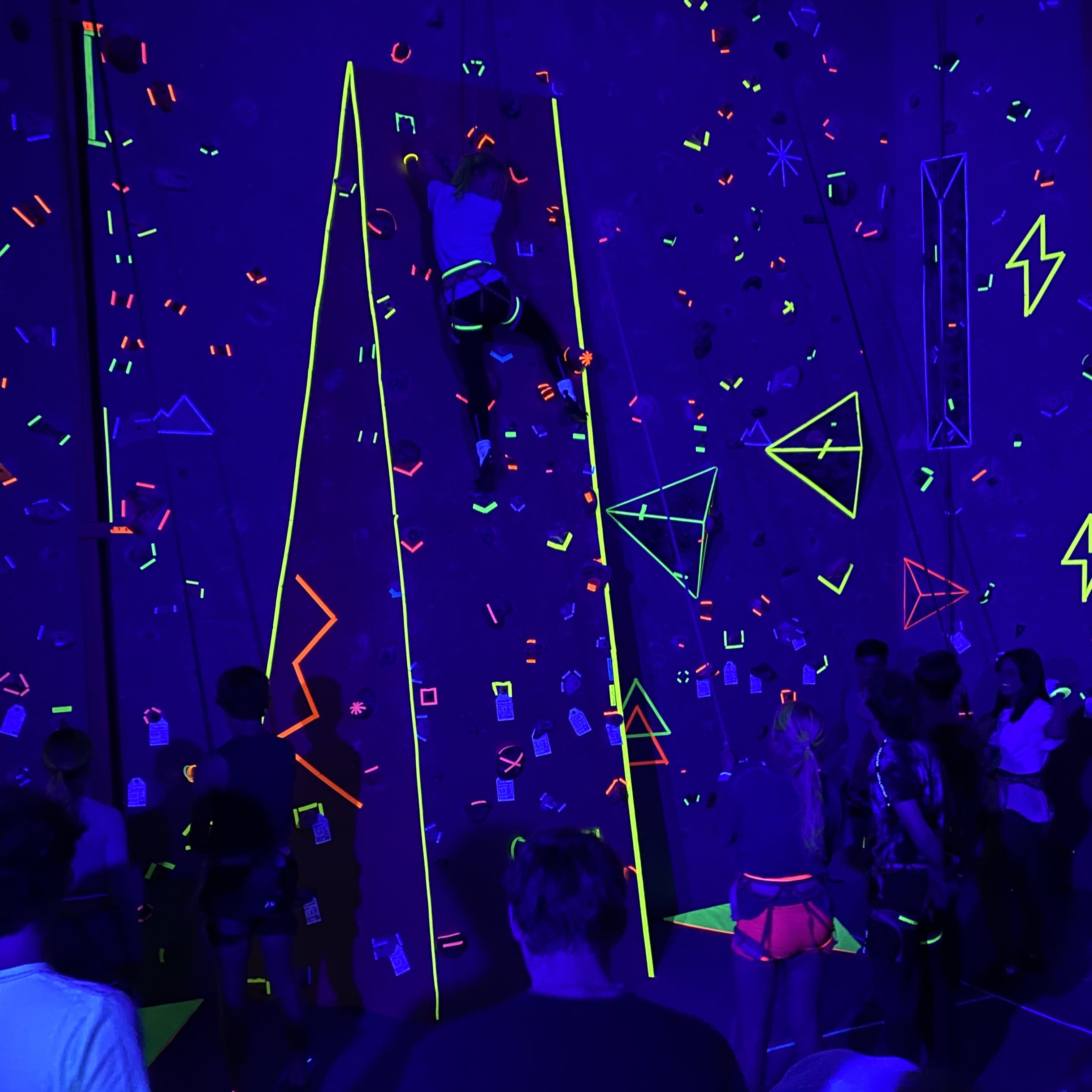 Blacklight rock climbers