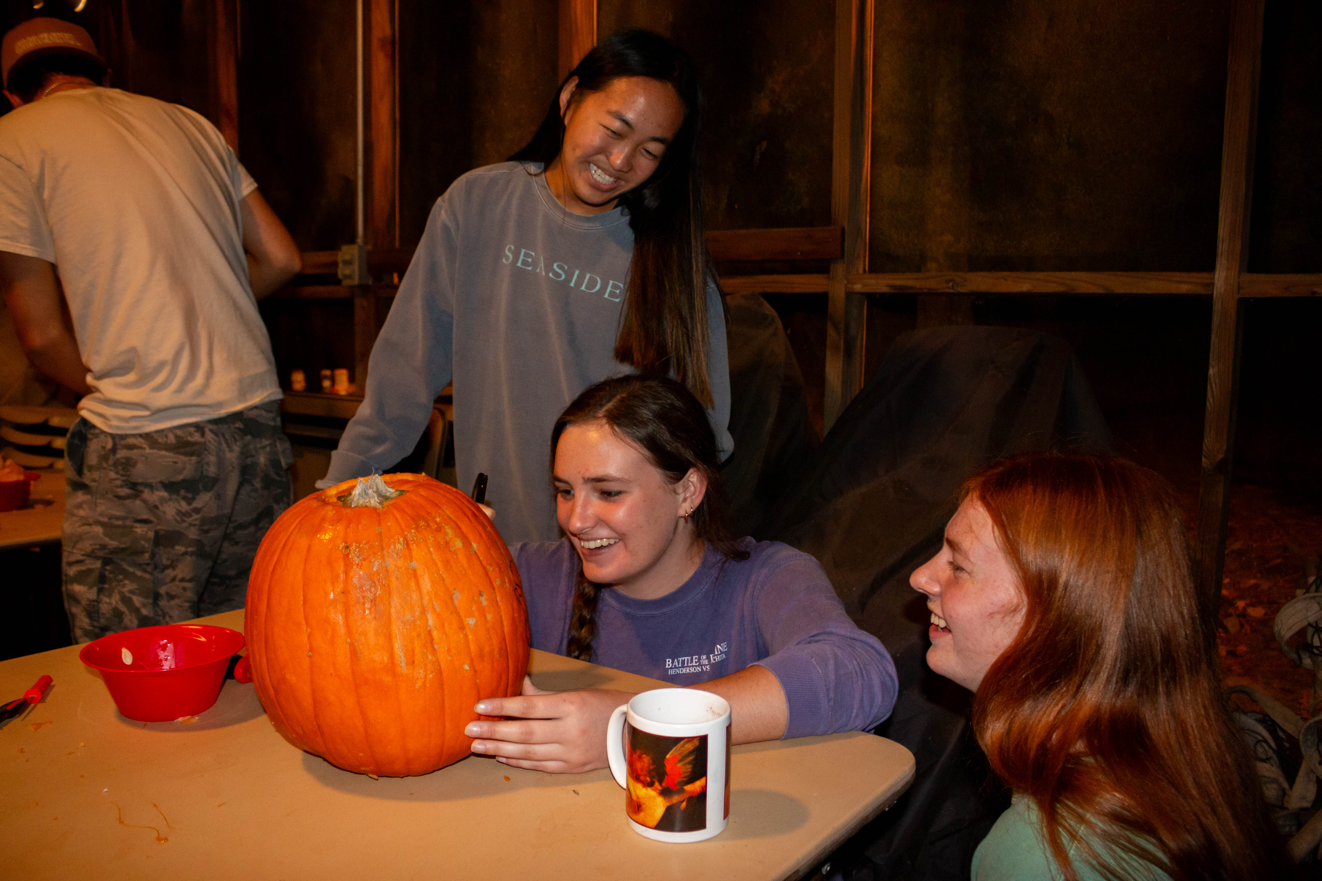 Students carving pumpkin