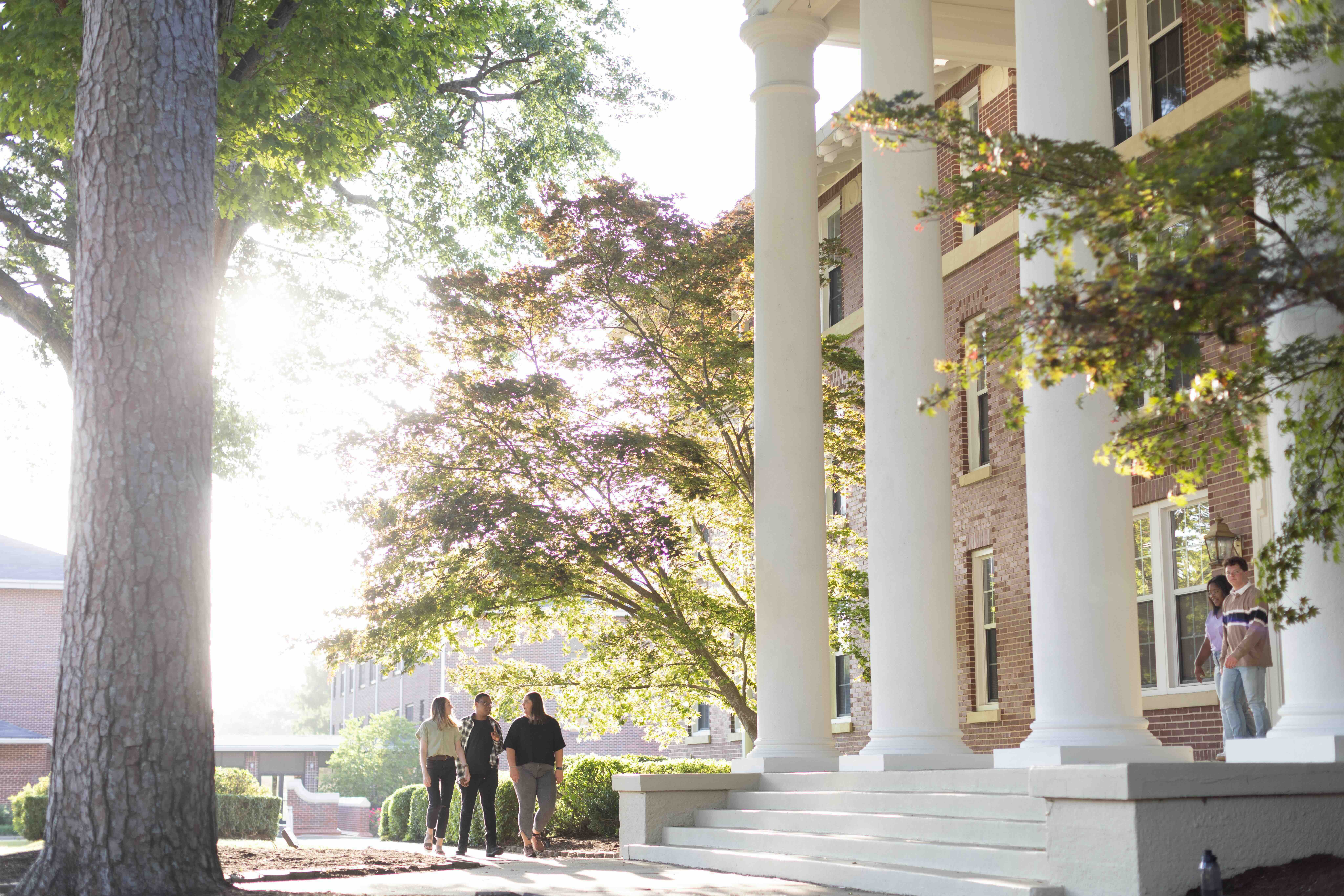 Students walking by Cone-Bottoms
